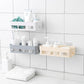 Wall-mounted shower shelf neatly holds toiletries in a bathroom corner.