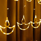 Full view of 12 Diya Curtain String Lights creating a warm glow in a home setting.