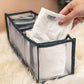 Organivo 7 Grid Clothes Organizer neatly storing folded jeans and t-shirts.
