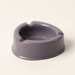 Oblivion grey plastic ashtray showcasing wide ash-collecting bowl