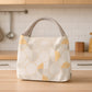Front view of the Lunchie Bunchie insulated lunch bag, showcasing its secure zip closure.
