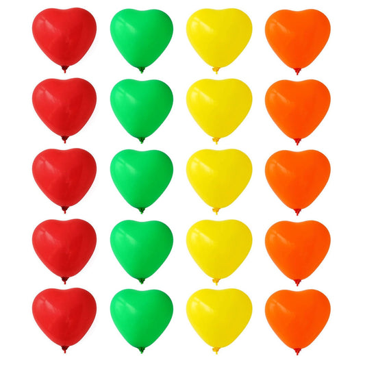 Close-up of a festive red heart shaped balloon with other rainbow party balloons.