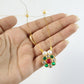 Delicate gold-tone necklace with vibrant multicolor floral pendant and pearl accents
