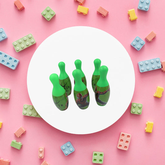 Arrangement of vibrant bowling pins and a ball, ready for a fun kids' game.