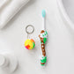 Front view of kids toothbrush and ball toy packaging with vibrant colors
