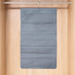 Foldable under garment organizer bag with multiple pockets hanging in closet