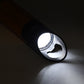 Mini LED torch illuminating a dark space, demonstrating its high lumen output.