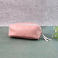 Compact PU leather travel organizer pouch filled with makeup brushes and stationery.