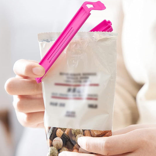 A close-up of an airtight food clip securely sealing a bag of chips.