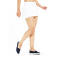 Back view of women's white athletic skort with a flowy design.