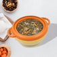 Insulated serving casserole with lid and ergonomic handles.