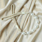 Stylish window drapery tieback featuring pearl beads