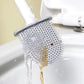 Silicone toilet brush with holder mounted on a clean bathroom wall.