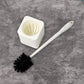 Complete toilet brush and holder unit, ready for immediate use.