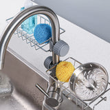 Stainless steel sink caddy organizer holding soap and sponge on kitchen sink