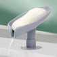Close-up of the strong suction cup on the leaf-shaped bathroom soap dish, ensuring stable placement.