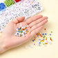 Open DIY bracelet making kit showcasing alphabet beads, tools, and string