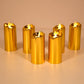 Three elegant golden LED candles creating a warm glow for home decor.