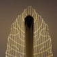Close-up of leaf design plastic shade on LED lamp