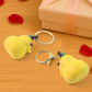 Cute Cartoon Couple keychains attached to a bag zipper