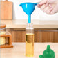 Green silicone funnel making liquid transfer easy in a modern kitchen setup.