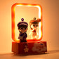 Close-up of LED decorative couple figurine light with love theme