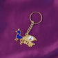 Gold-tone Krishna metal keychain displayed on white background