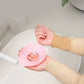 Person wearing pink silicone wrist band while washing face to prevent water drips