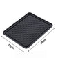 The non-slip anti-skid mat demonstrated holding small items firmly in place.