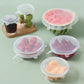 Set of 6 reusable silicone food covers on kitchen table