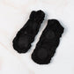 Pair of no-show liner socks laid flat, showing minimal coverage
