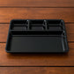 Rectangular plastic 4-compartment meal tray with four sections for neat plating.