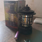 Elegant retro style rechargeable LED camping lantern displayed on a wooden table.