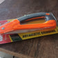 A versatile Folding Pruning Saw resting in a vibrant garden, ready for various pruning tasks.