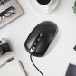 Top-down view of the black wired optical mouse, showcasing its simple and functional layout.