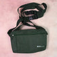 Person comfortably carrying the Hajj shoulder bag during travel.