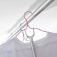 Collapsible garment hanging stick demonstrating its compact storage feature.