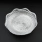 An empty round plastic tray showcasing its traditional design.