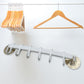 Kitchen towel hanger mounted on a wall, showcasing its versatility for kitchen use.