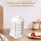 Close-up of the plastic kitchen bowl rack with air-drying dishes, showing drainage design.