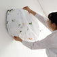 Elegant indoor AC unit cover with a vibrant print, protecting from dust.