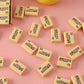 A rectangular bright yellow 4B eraser ready for school or office tasks.