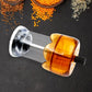 Angled view of the transparent plastic salt and pepper grinder.