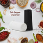 Elegant polycarbonate salt and pepper dispensers on a modern dining table.