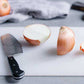 Sturdy plastic chopping board, ideal for daily food preparation in Indian kitchens.