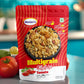 Close-up of Maniarr's Tomato Roasted Multigrain Mixture, highlighting its crunchy texture and tomato seasoning.