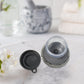 Compact kitchen cleaning brush with an integrated soap dispenser, ideal for small spaces.