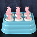 6-cavity giraffe shaped plastic ice cube molds on a white surface