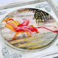 Styled 12x12 inch picture frame holding a vibrant art print.