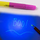 Hand holding the versatile 3-in-1 ball pen with marker and LED light